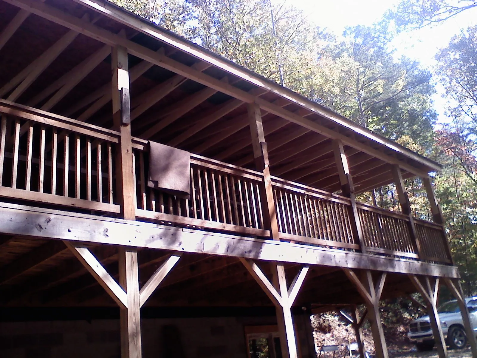 Timber framing under a new elevated porch and deck — Roof Leak Repair in East Pembroke by Roofing Brothers